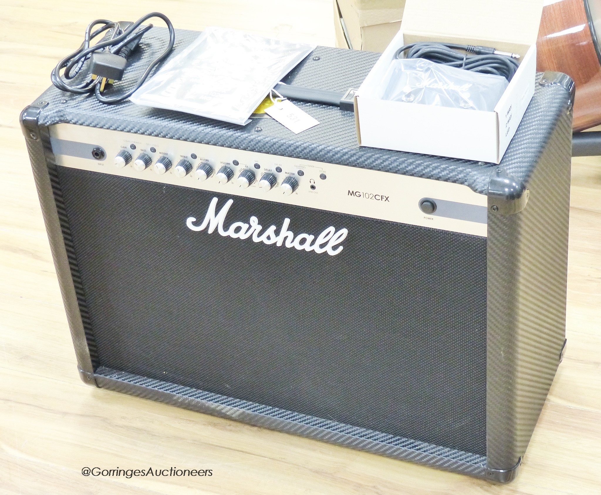 A Marshall MG 102 CF guitar amp with footswitch